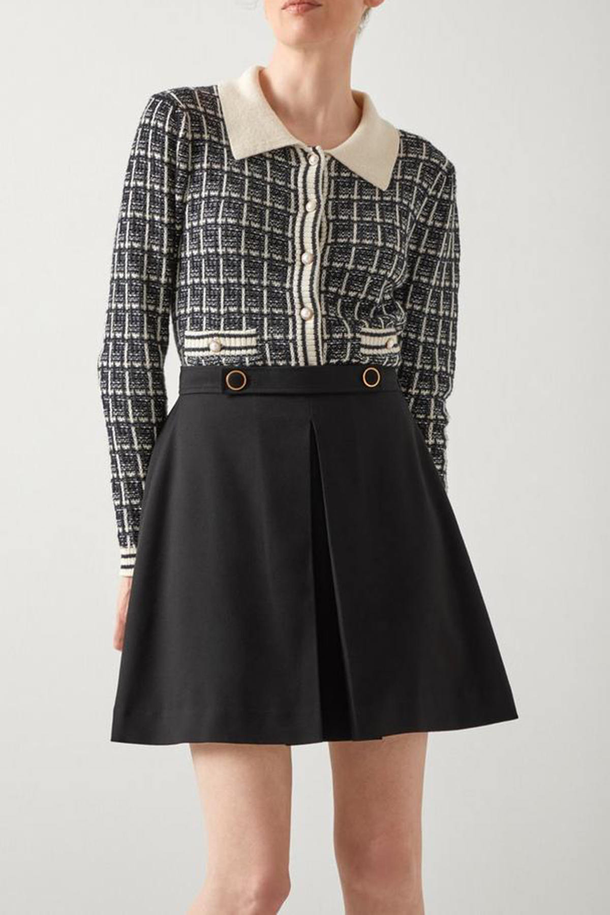 Black Pleated Mini Skirt with Metal Accents - notariosoax
